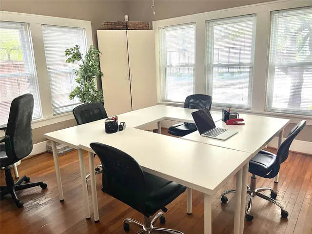 a dining room with furniture and window