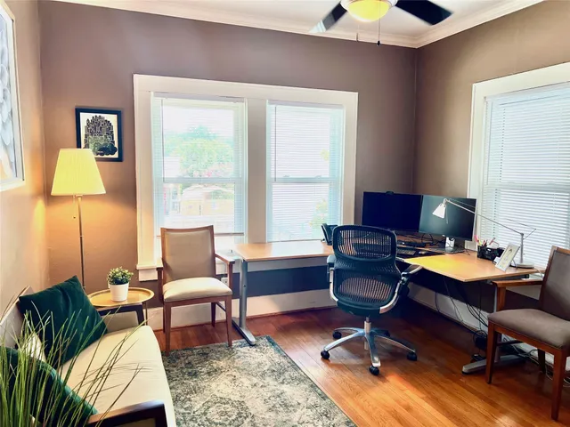 a workspace with furniture and a window