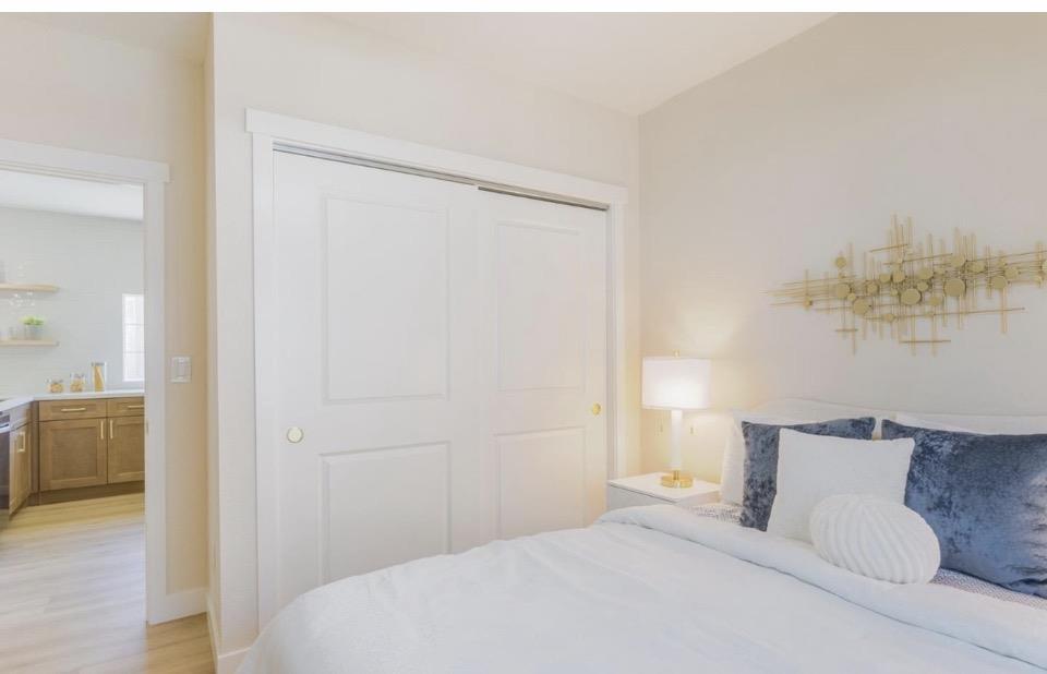 735 Locust Street San Jose, CA 95110 - Photo 17 of 21 a bedroom with a bed and a view of bathroom