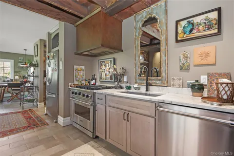 a kitchen with stainless steel appliances granite countertop a sink and cabinets