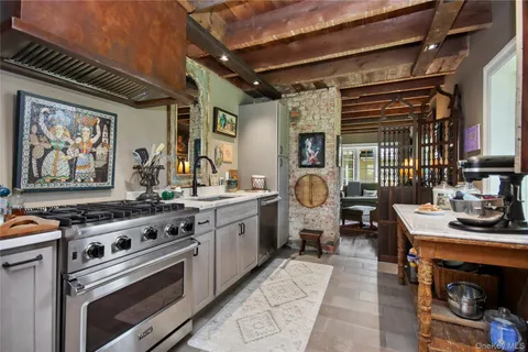a kitchen with stove and cabinets