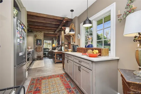 a kitchen with a sink and a stove top oven