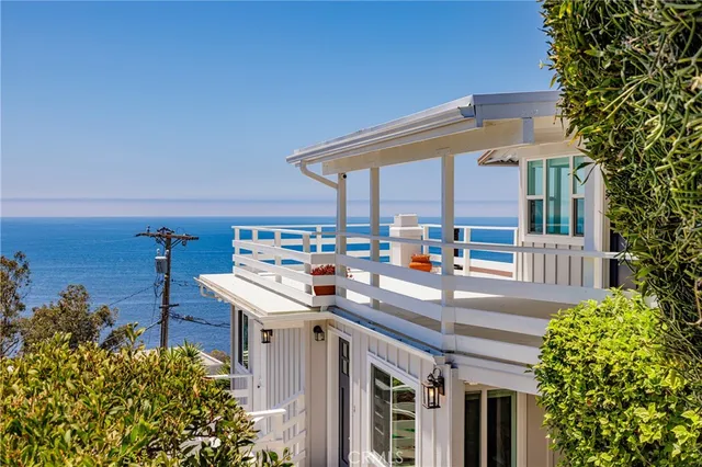a utility room with dryer and next to a road