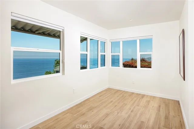 front view of a house with a large window