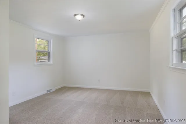 an empty room with windows