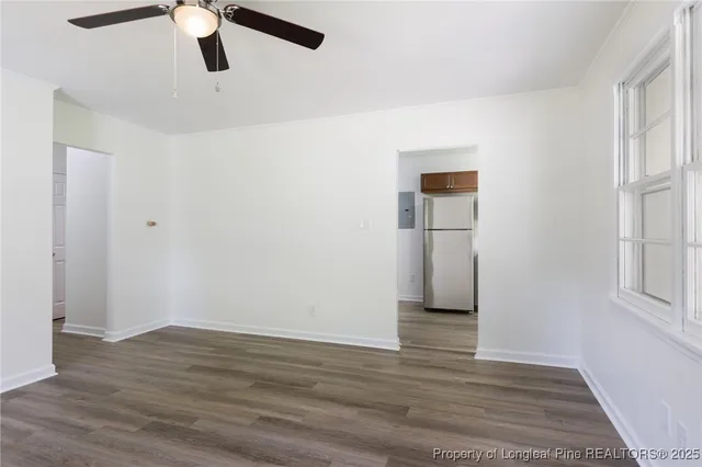 wooden floor in an empty room with a window