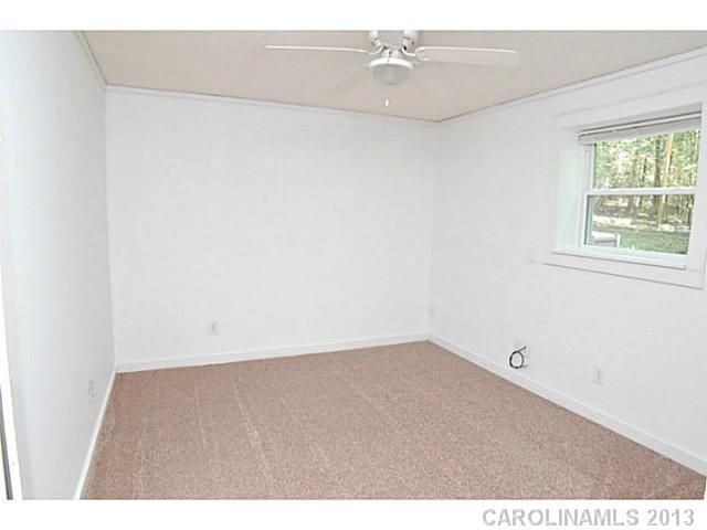 5413 Stone Mill Road Waxhaw, NC 28173 - Photo 11 of 16 an empty room with a window