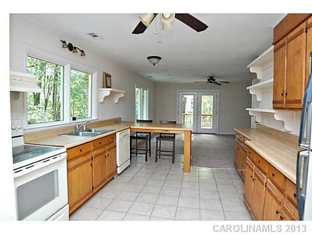 5413 Stone Mill Road Waxhaw, NC 28173 - Photo 3 of 16 a large white kitchen with a large window