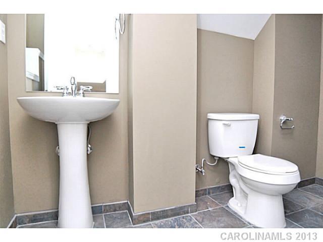 5413 Stone Mill Road Waxhaw, NC 28173 - Photo 9 of 16 a bathroom with a sink toilet and a mirror