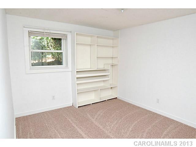 5413 Stone Mill Road Waxhaw, NC 28173 - Photo 10 of 16 a view of empty room with window and cabinet