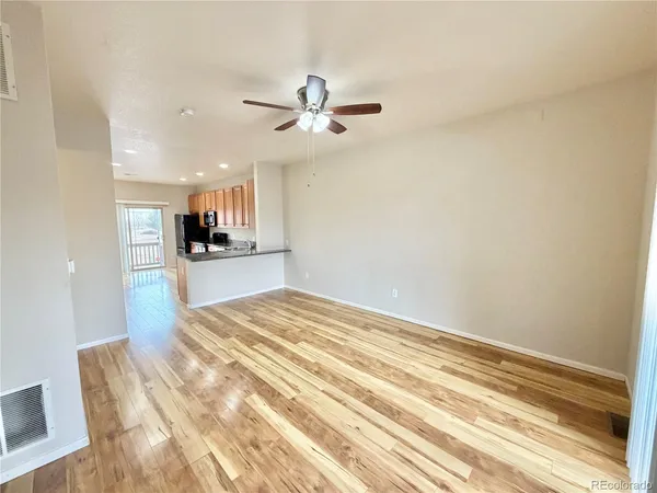 a view of a kitchen with a kitchen and a ceiling fan