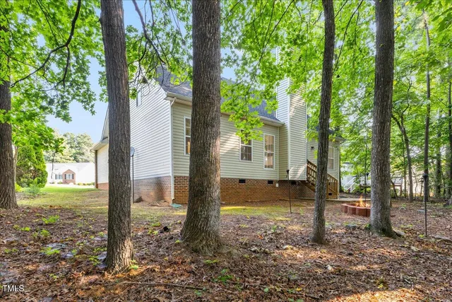 a backyard of a house with lots of green space