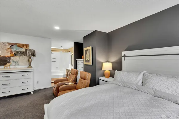 a bedroom with a bed and closet with window