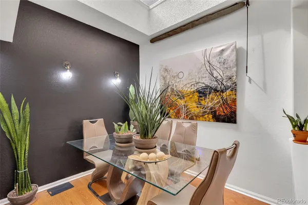a view of a dining room with furniture and wooden floor