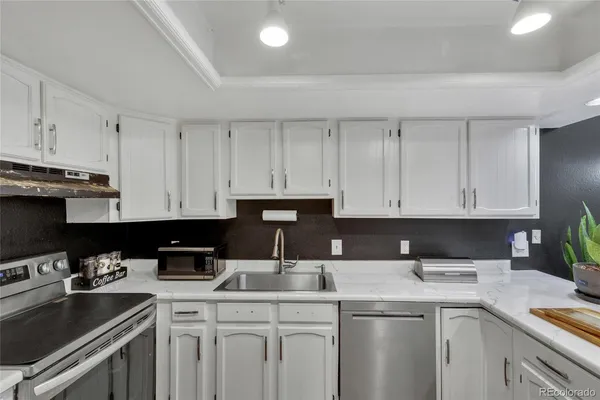 a kitchen with a sink and cabinets