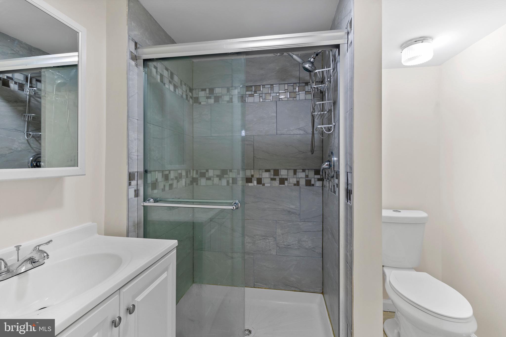 38 Deepspring Court Reisterstown, MD 21136 - Photo 10 of 17 a bathroom with a sink toilet and shower