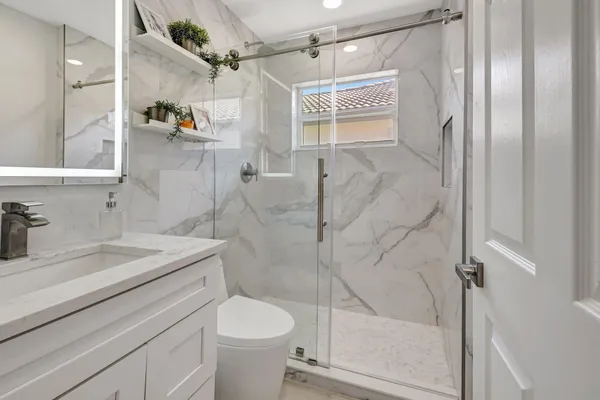 an empty room with wooden floor and a window