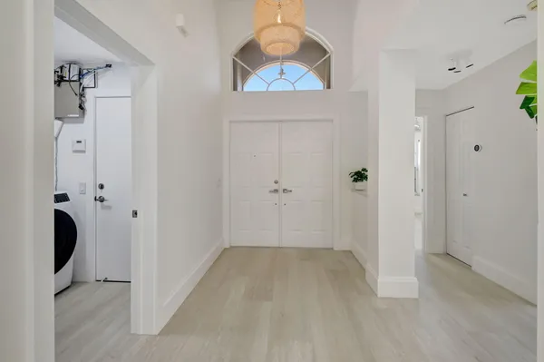 an empty room with a empty space and windows