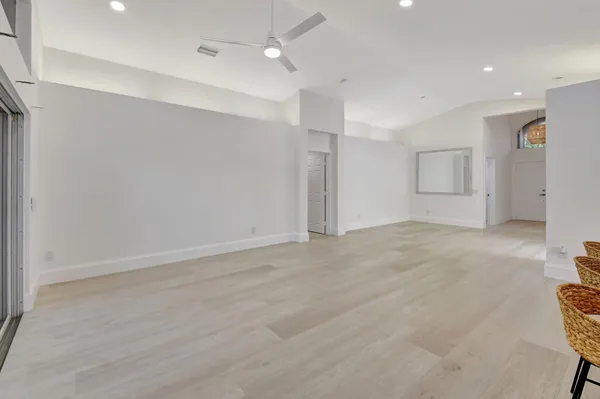 an aerial view of a houses with a swimming pool