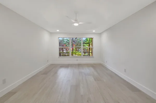 a view of a swimming pool and lounge chair