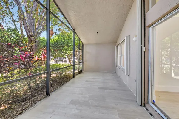a living room with furniture and white walls