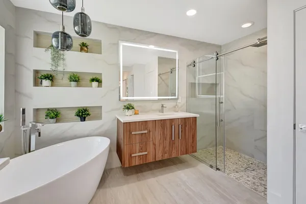 a view of a hallway with wooden floor and closet area