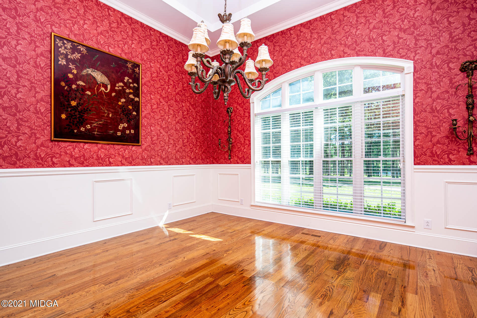 2138 Midway Road Lizella, GA 31052 - Photo 12 of 47 a view of an empty room with wooden floor and a window