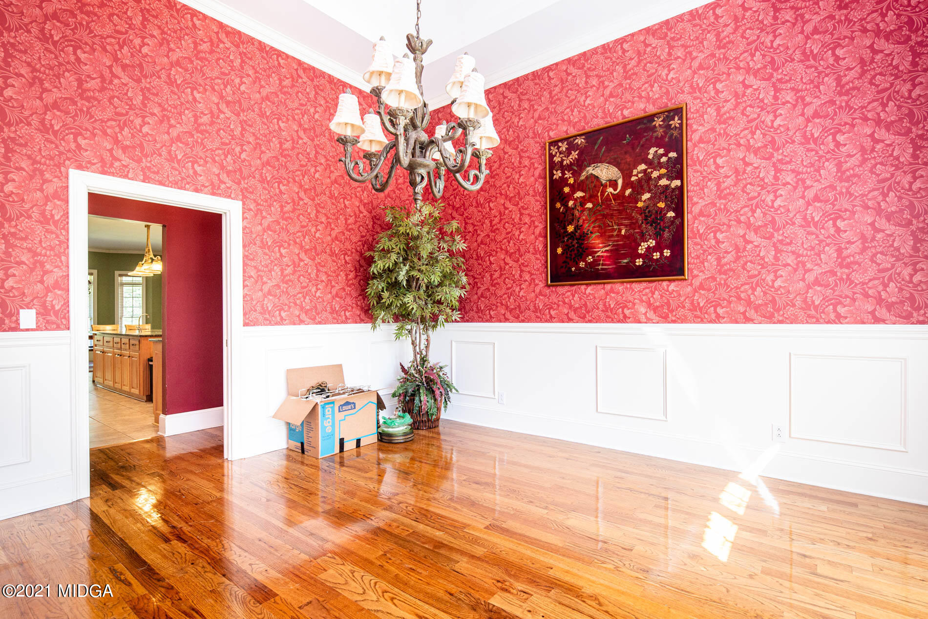2138 Midway Road Lizella, GA 31052 - Photo 14 of 47 a view of a dining room with furniture wooden floor and a chandelier