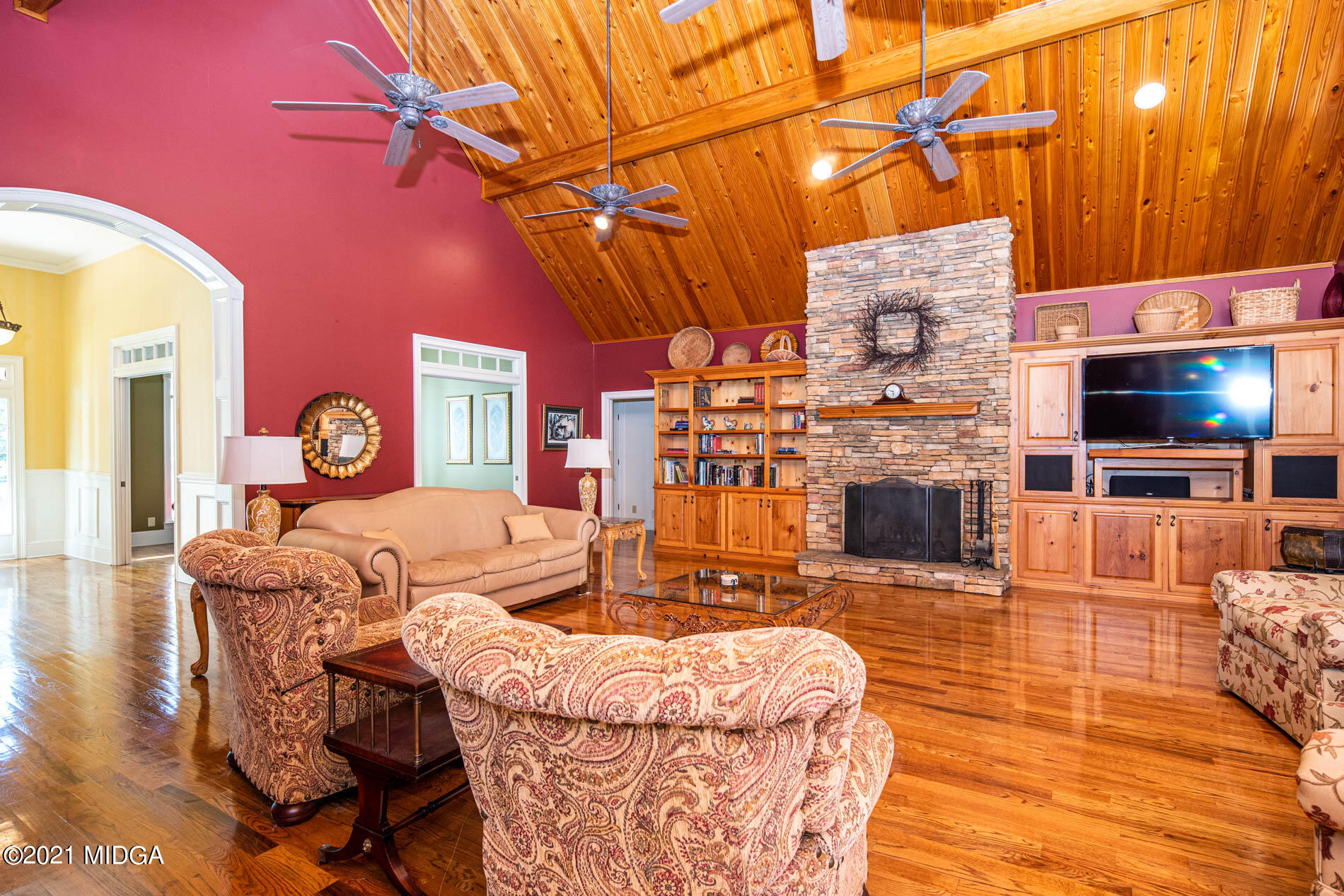 2138 Midway Road Lizella, GA 31052 - Photo 18 of 47 a living room with furniture a flat screen tv and a fireplace
