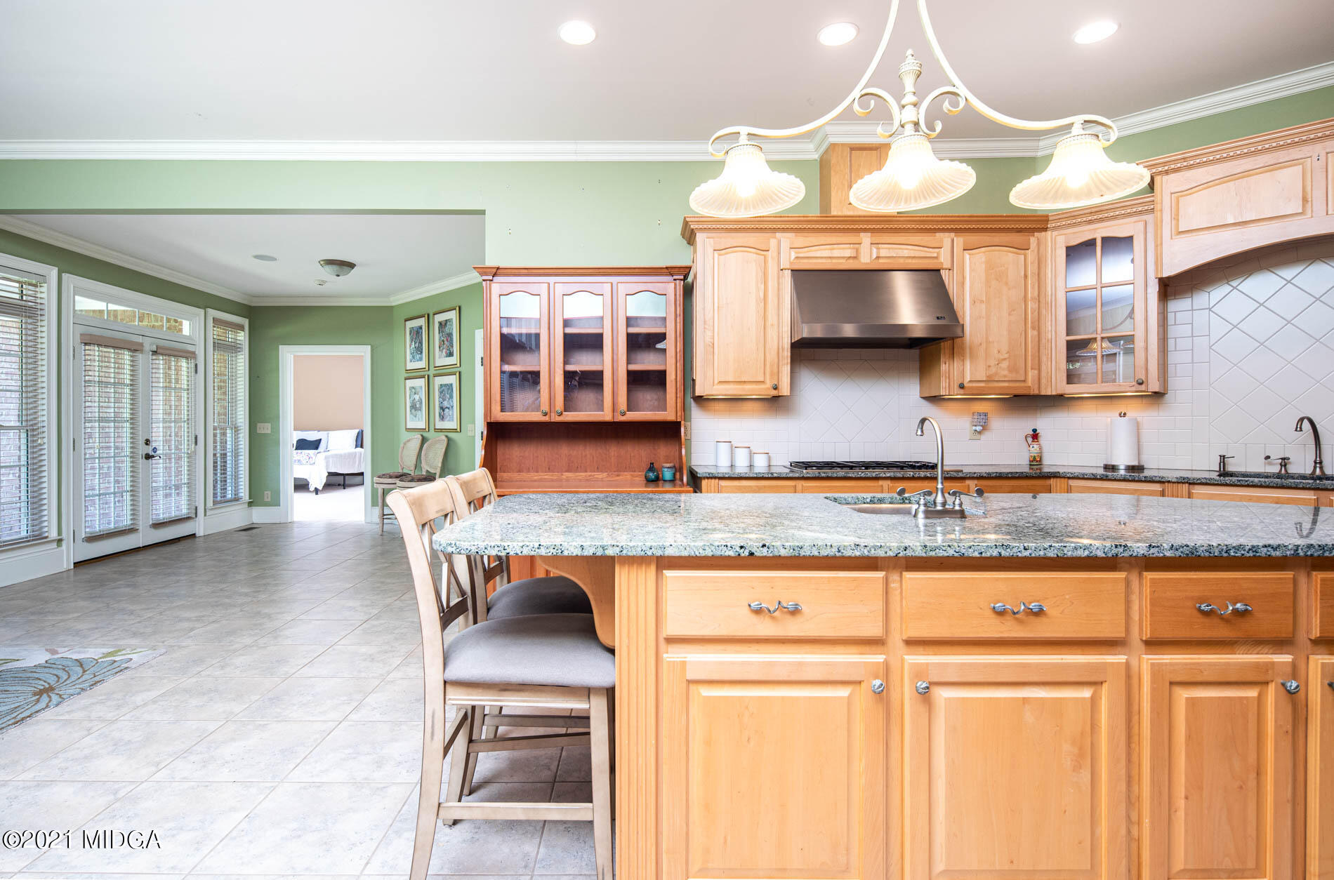 2138 Midway Road Lizella, GA 31052 - Photo 19 of 47 a open kitchen with granite countertop a stove and white cabinets