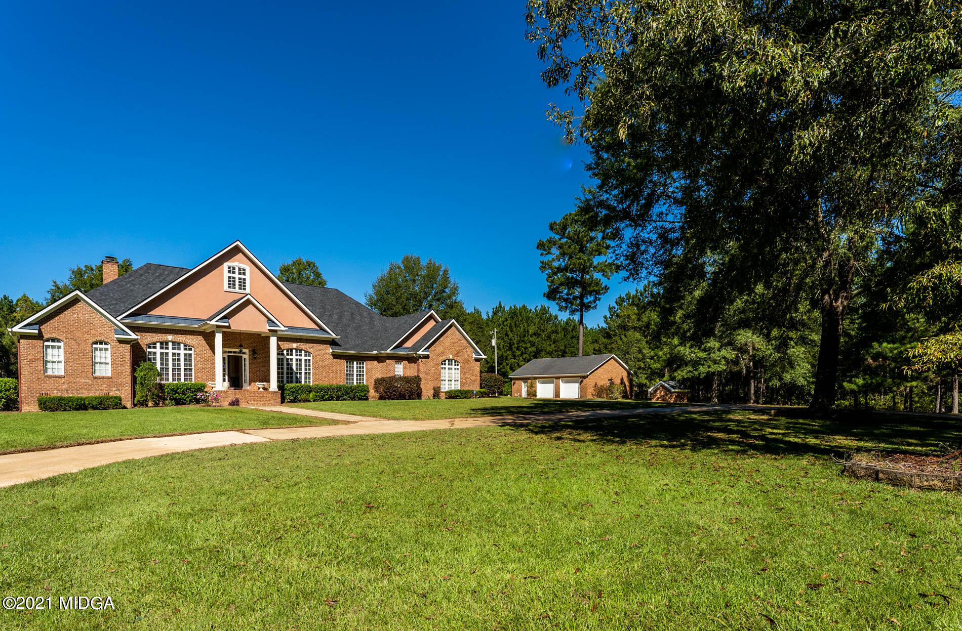 2138 Midway Road Lizella, GA 31052 - Photo 3 of 47 a front view of a house with a garden