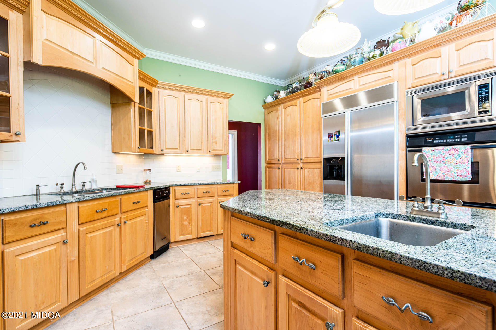 2138 Midway Road Lizella, GA 31052 - Photo 22 of 47 a kitchen with stainless steel appliances granite countertop a sink and cabinets