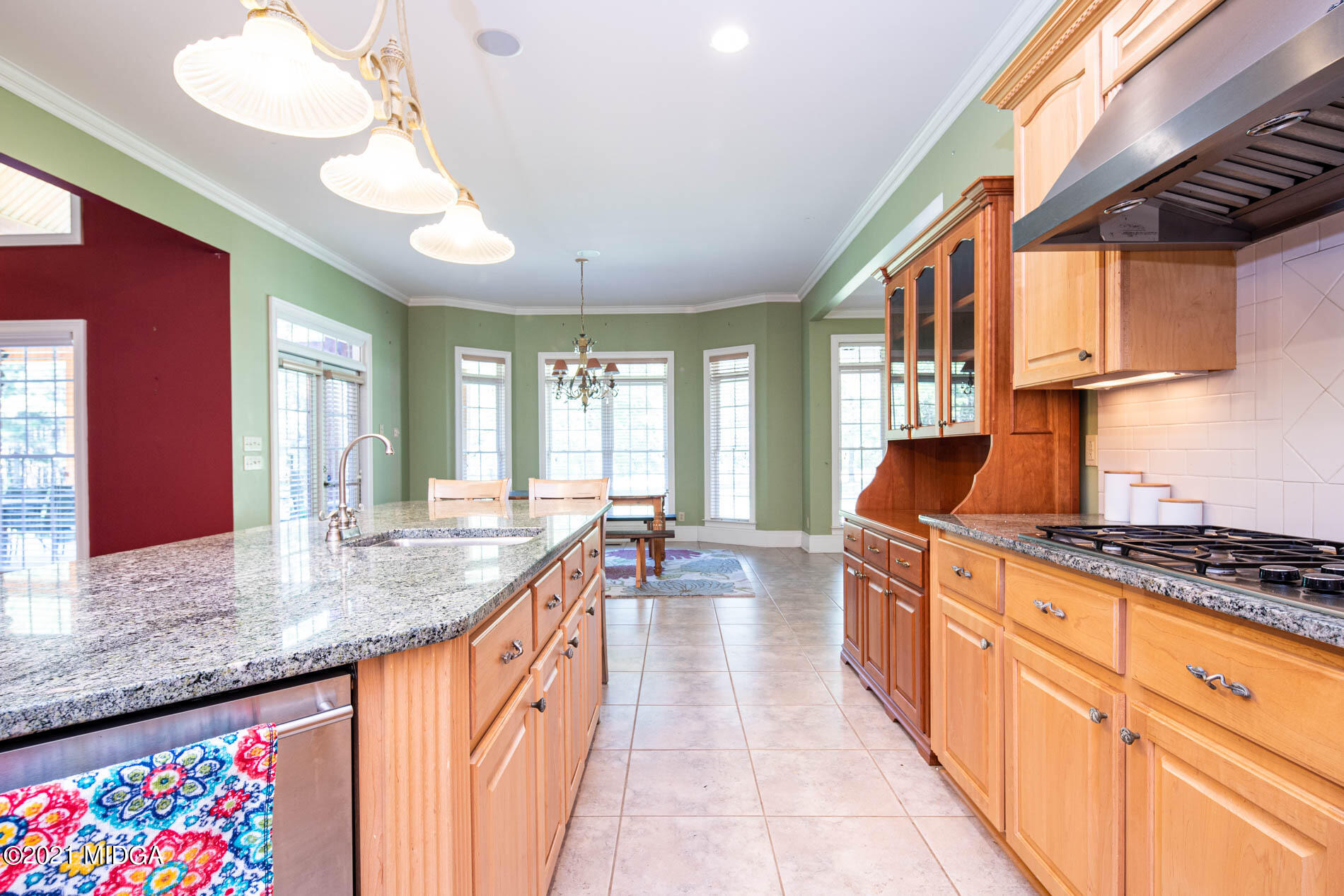 2138 Midway Road Lizella, GA 31052 - Photo 23 of 47 a kitchen with stainless steel appliances granite countertop a sink stove and cabinets