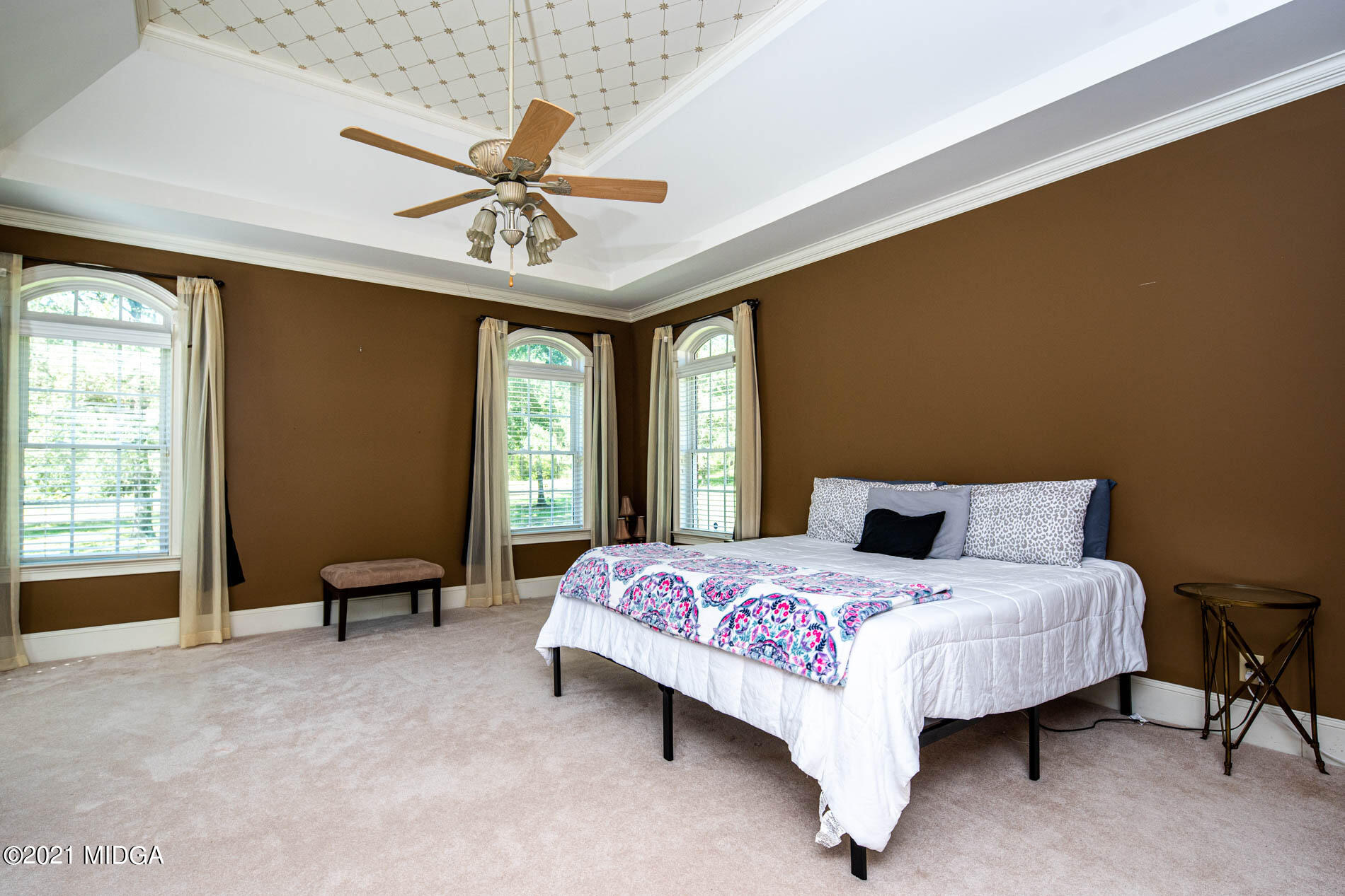 2138 Midway Road Lizella, GA 31052 - Photo 28 of 47 a bedroom with a bed chandelier and a window