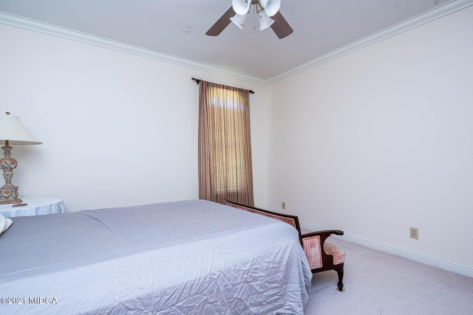 2138 Midway Road Lizella, GA 31052 - Photo 35 of 47 a bedroom with a bed and a chandelier fan