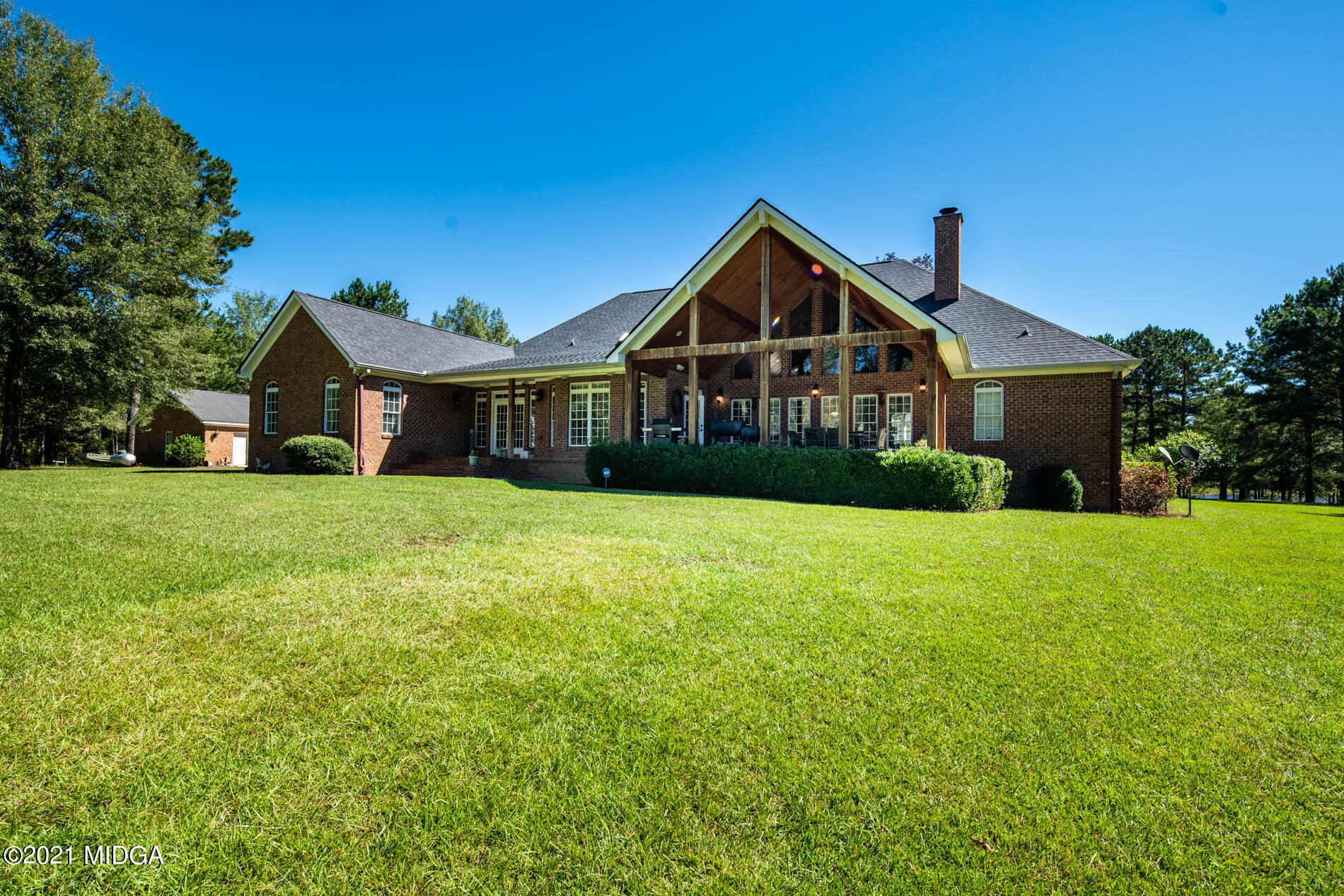 2138 Midway Road Lizella, GA 31052 - Photo 44 of 47 a front view of a house with yard and green space