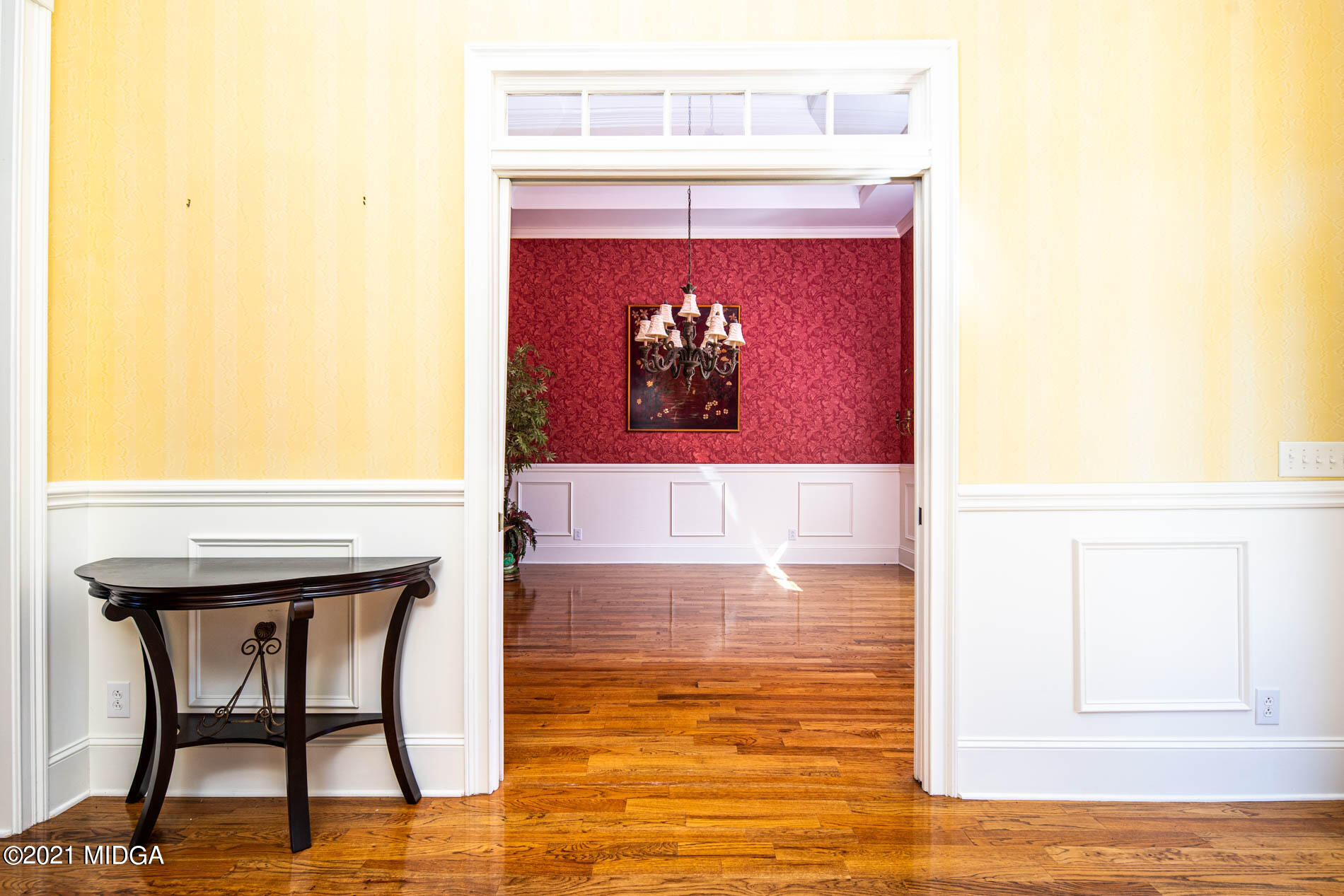 2138 Midway Road Lizella, GA 31052 - Photo 10 of 47 a hallway with a table and a painting on the wall