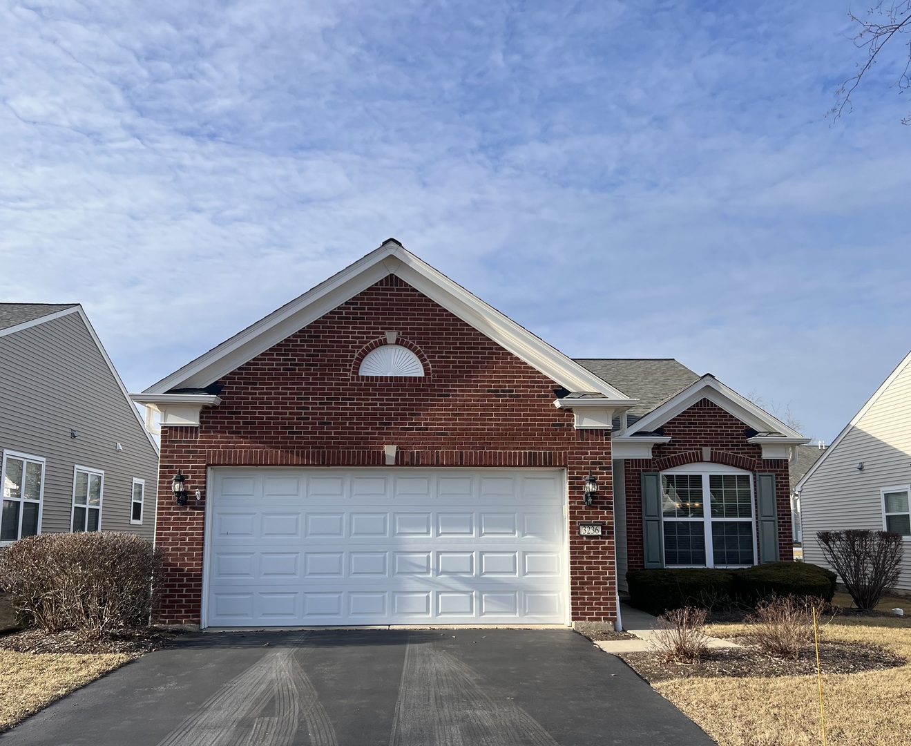 3236 Hutchinson Lane Mundelein, IL 60060 - Photo 1 of 12 a front view of a house with a yard