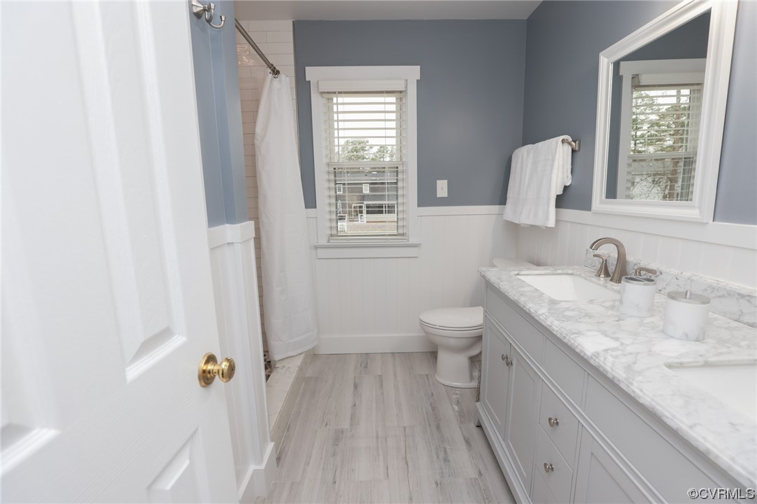 8226 Lucille Road Mechanicsville, VA 23111 - Photo 24 of 48 a bathroom with a granite countertop sink toilet and shower