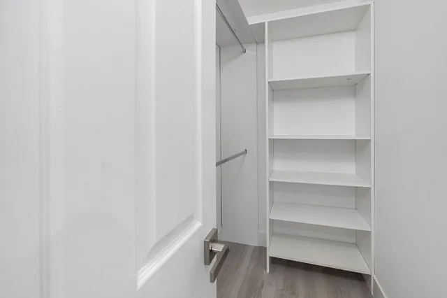 a view of an empty walk in closet