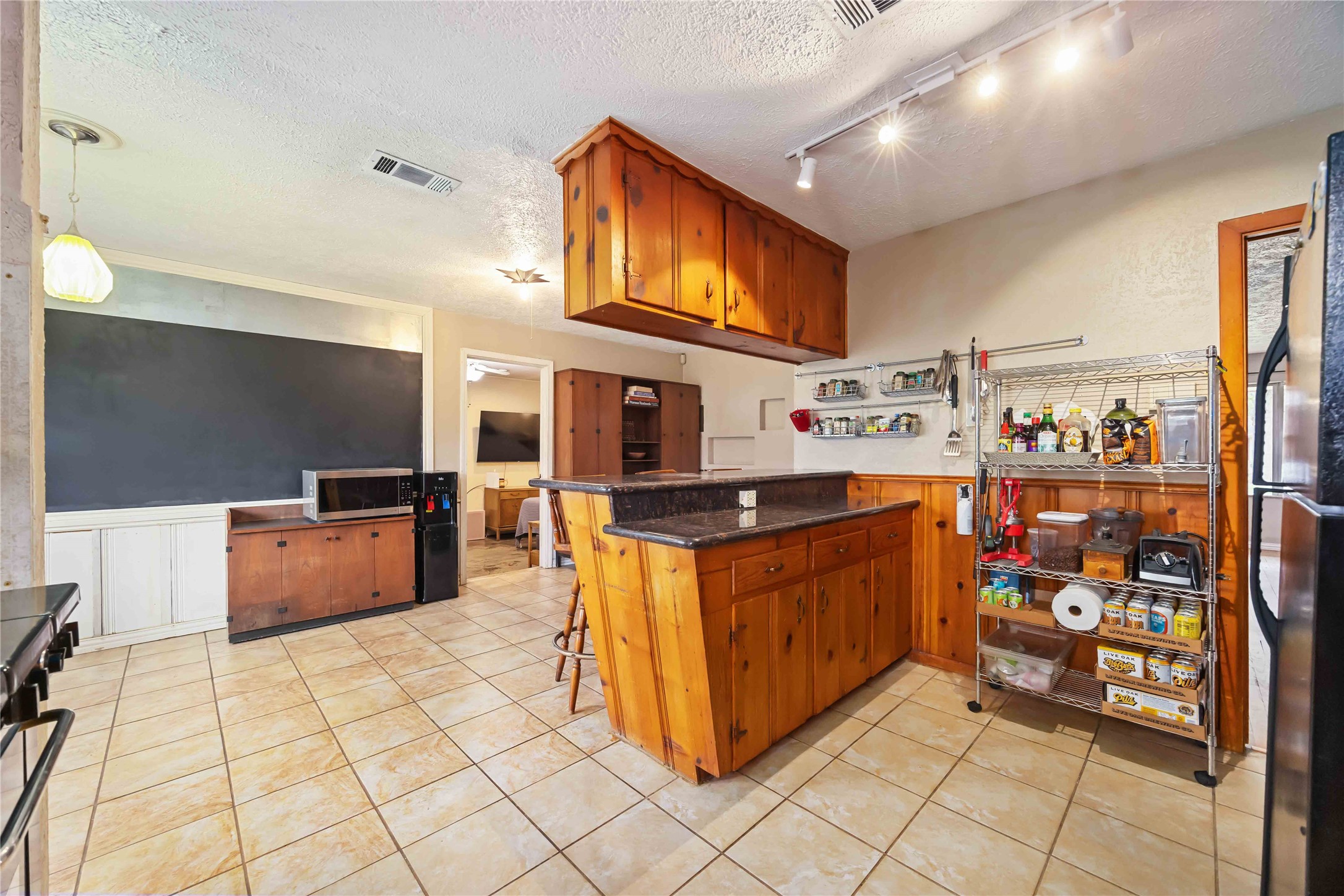 4501 Verdome Lane Houston, TX 77092 - Photo 27 of 27 a large kitchen with stainless steel appliances granite countertop a large stove a sink and a microwave