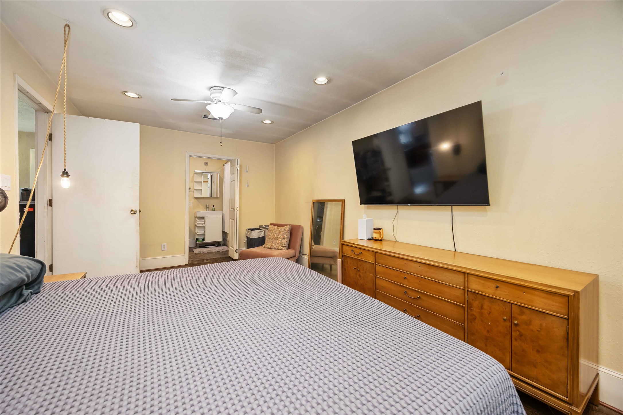 4501 Verdome Lane Houston, TX 77092 - Photo 21 of 27 a bedroom with a bed and a flat screen tv