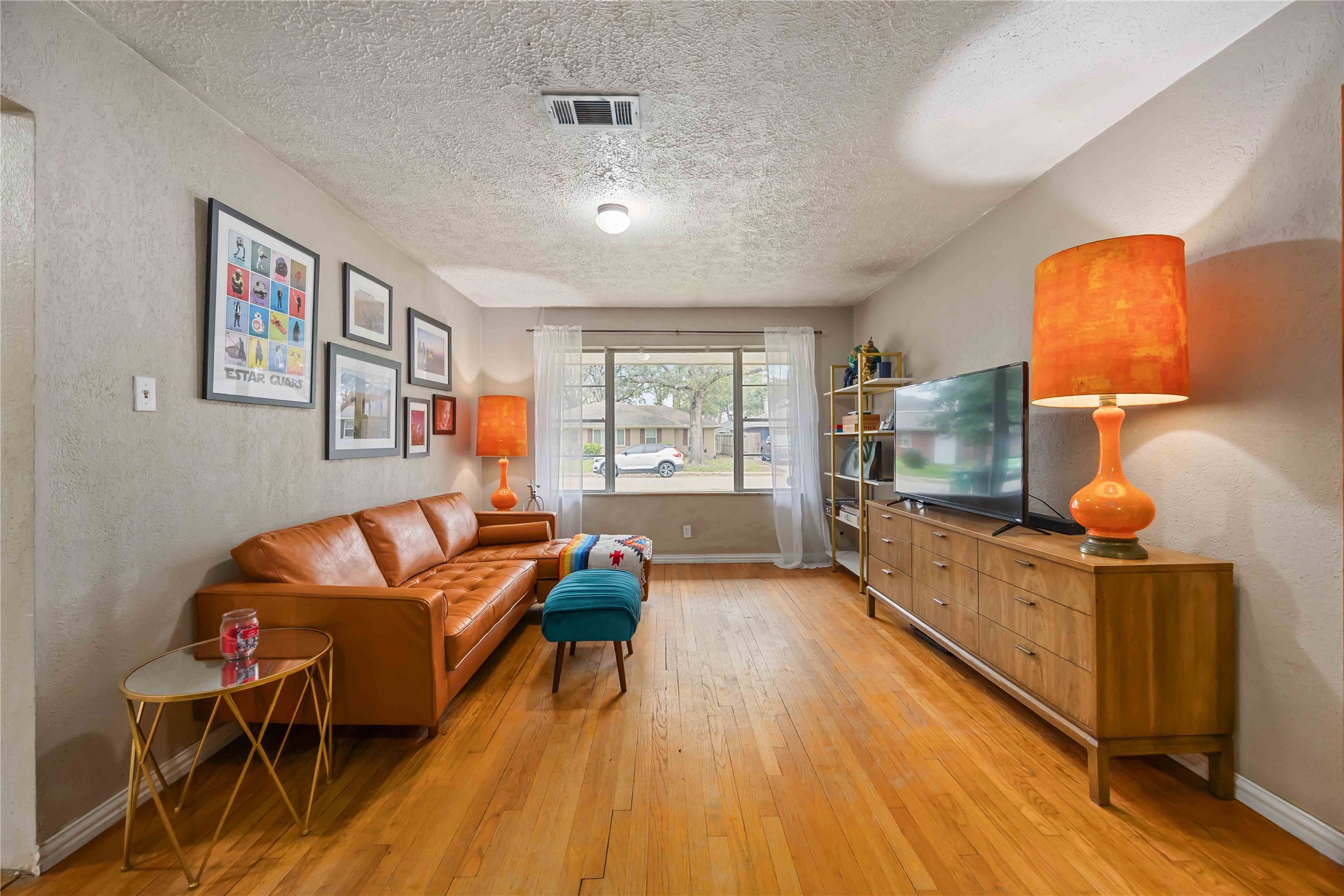 4501 Verdome Lane Houston, TX 77092 - Photo 5 of 27 a living room with furniture and a flat screen tv