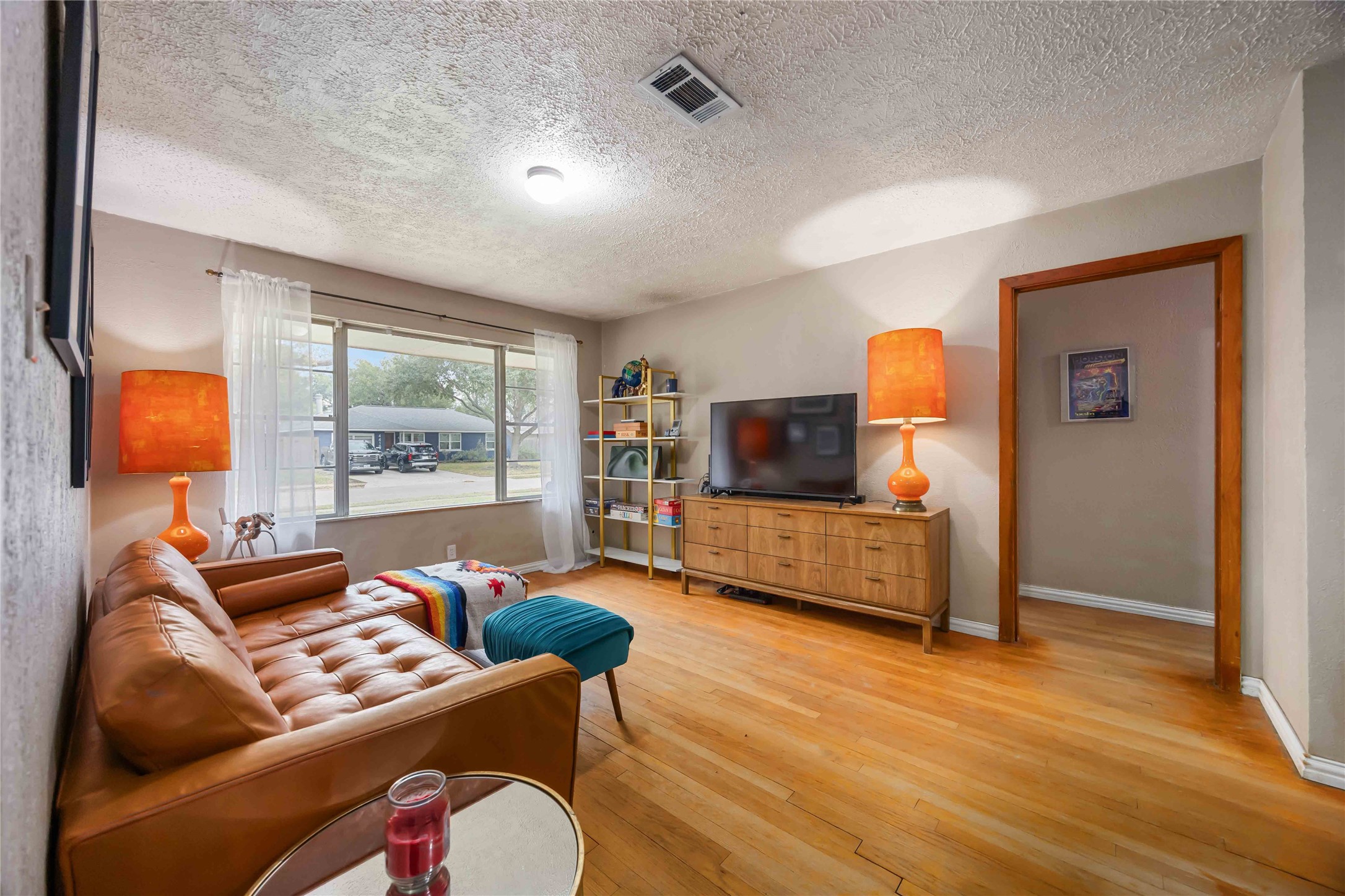 4501 Verdome Lane Houston, TX 77092 - Photo 6 of 27 a living room with furniture and a flat screen tv