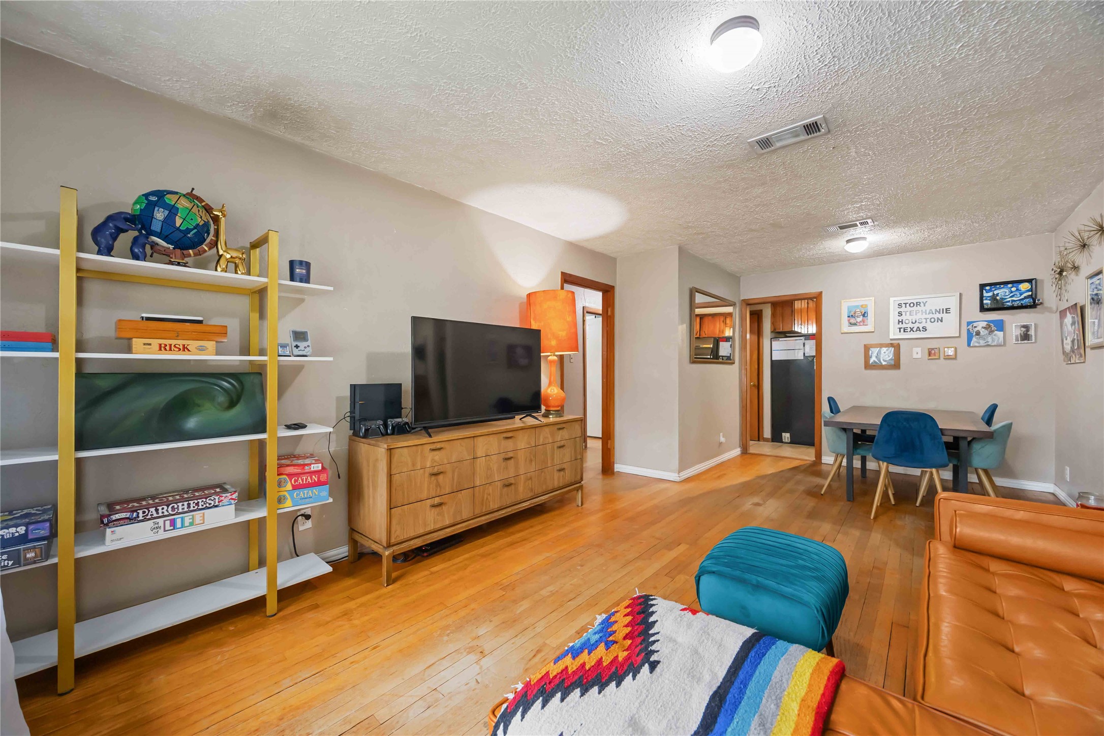 4501 Verdome Lane Houston, TX 77092 - Photo 7 of 27 a living room with furniture and a flat screen tv