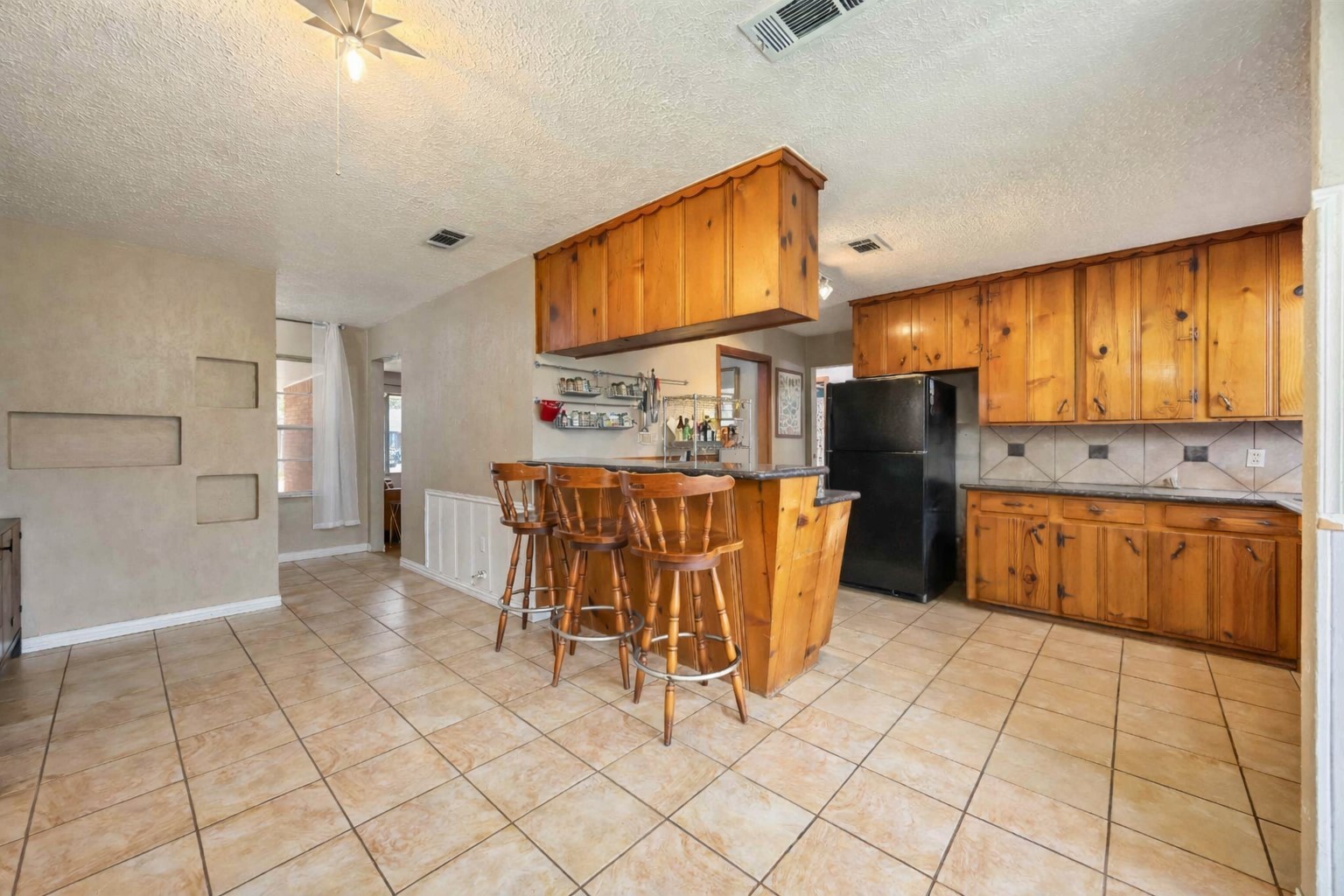 4501 Verdome Lane Houston, TX 77092 - Photo 8 of 27 a kitchen with stainless steel appliances a refrigerator sink and cabinets