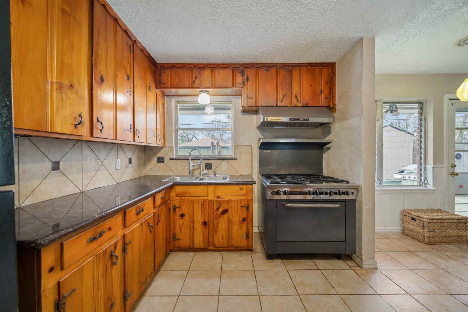4501 Verdome Lane Houston, TX 77092 - Photo 10 of 27 a kitchen with stainless steel appliances granite countertop a stove a sink and a microwave