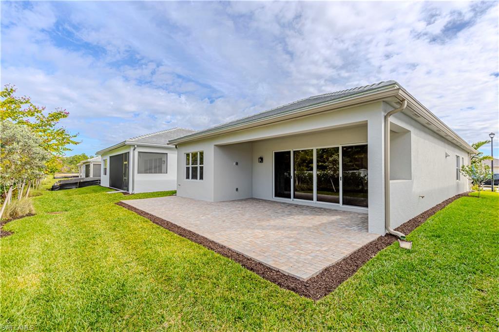 2691 Ridgecrest Place Naples, FL 34112 - Photo 23 of 27 a house with swimming pool in front of it