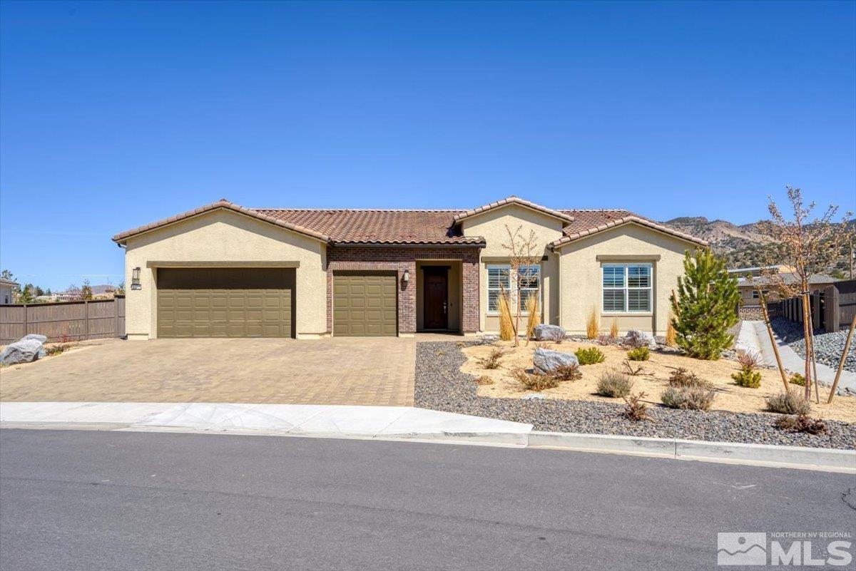 a front view of a house with a outdoor space