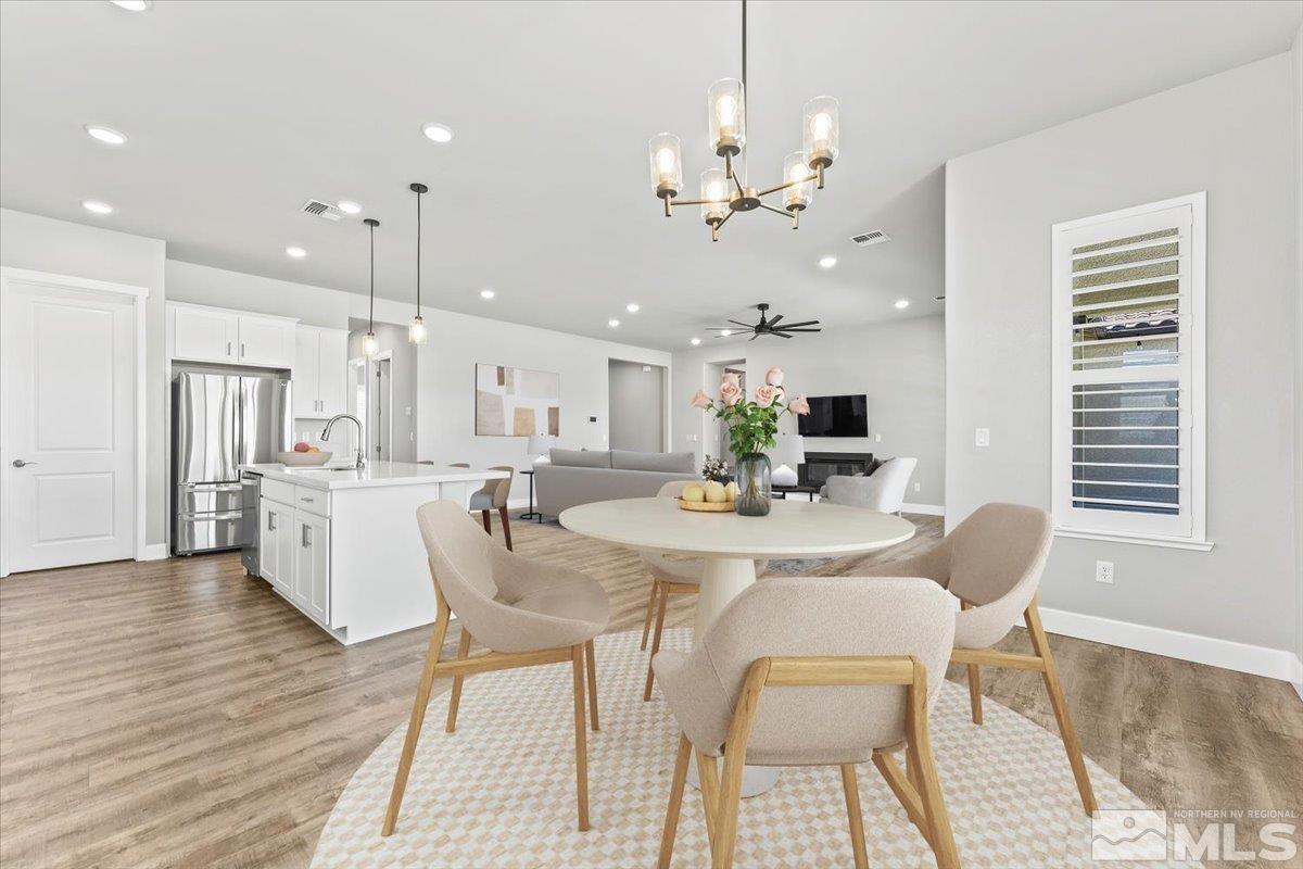 1273 Crawford Crk Drive Reno, NV 89521 - Photo 13 of 39 a view of a dining room with furniture and wooden floor